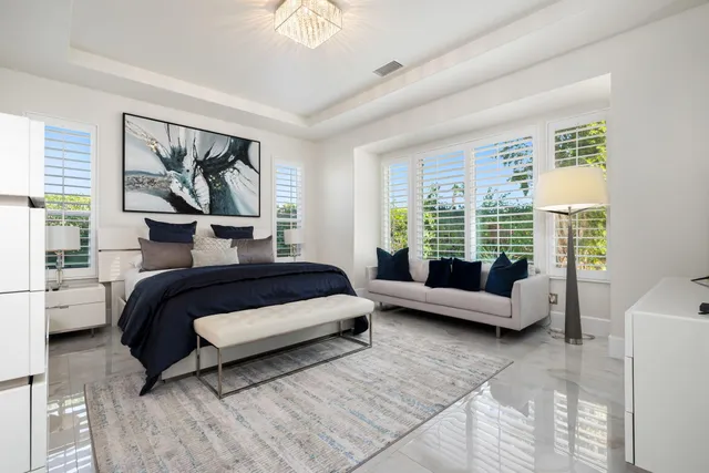 a view of a backyard with plants and patio