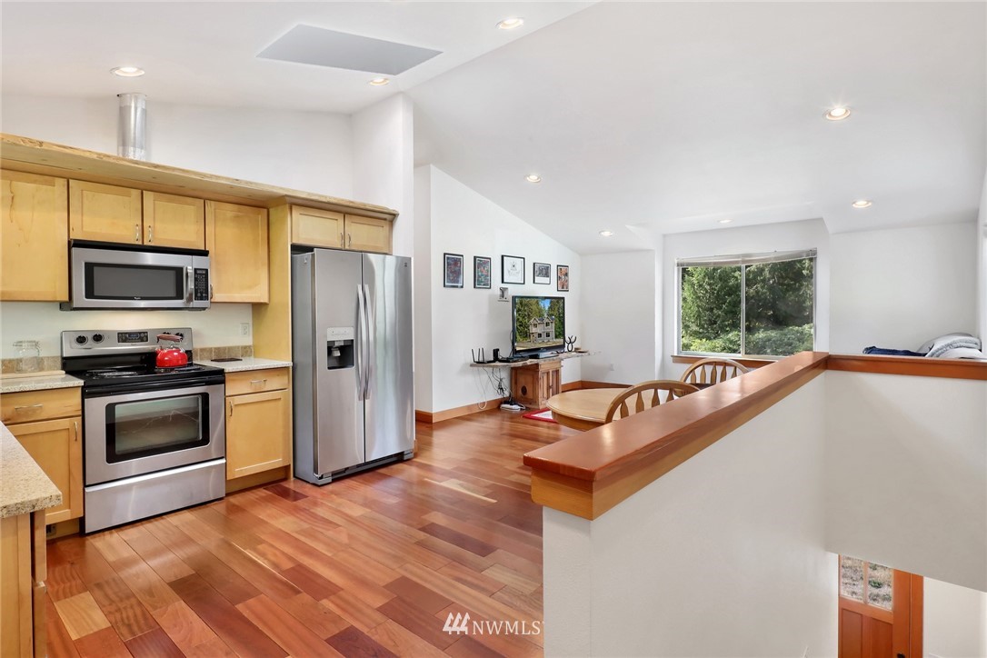 4760 Mission Road Bellingham, WA 98226 - Photo 12 of 40 a kitchen with stainless steel appliances granite countertop a refrigerator a stove top oven a sink dishwasher and a refrigerator