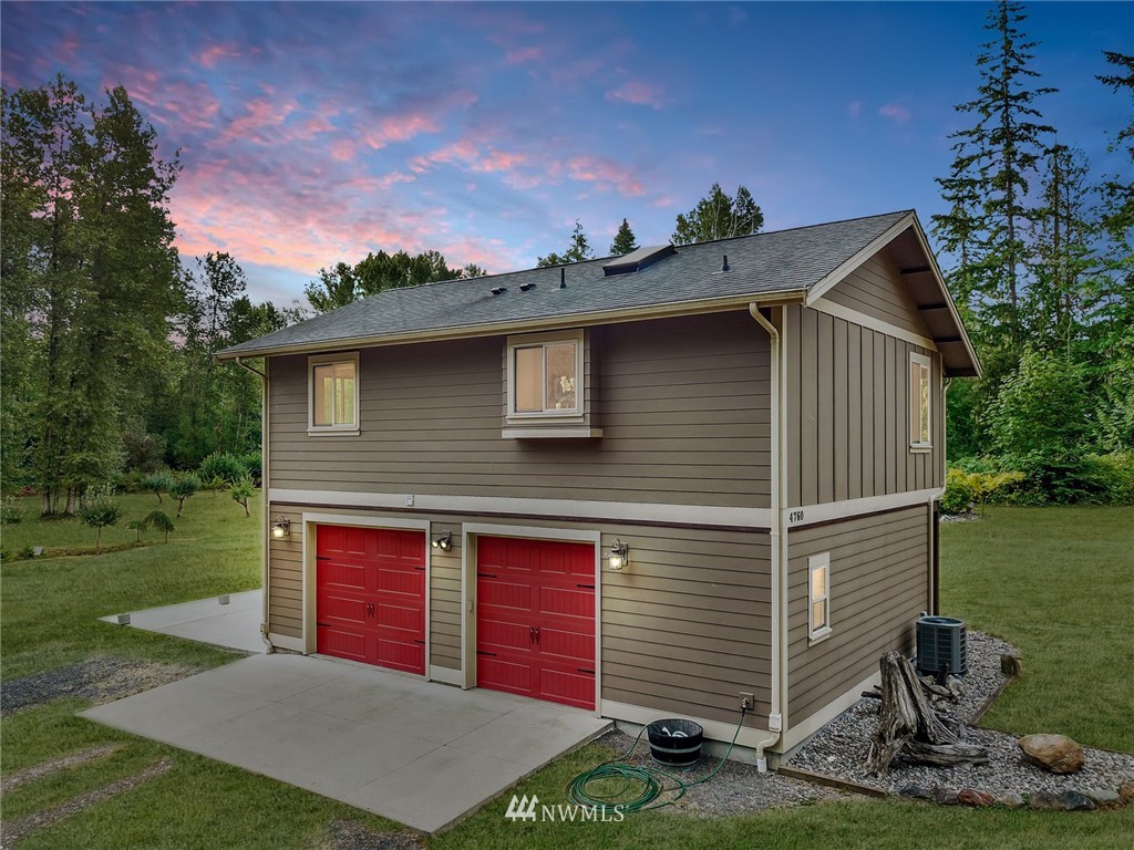 4760 Mission Road Bellingham, WA 98226 - Photo 3 of 40 a front view of a house with a yard