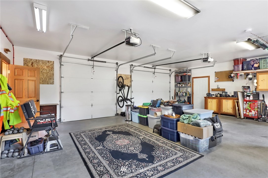 4760 Mission Road Bellingham, WA 98226 - Photo 28 of 40 a living room with furniture and a rug