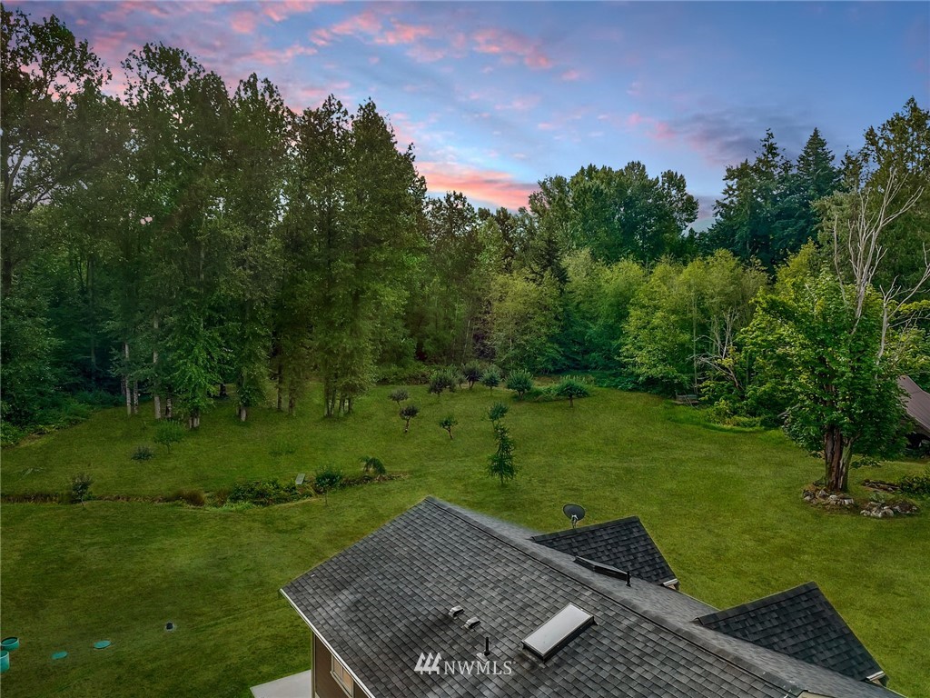 4760 Mission Road Bellingham, WA 98226 - Photo 6 of 40 a view of a backyard with a garden