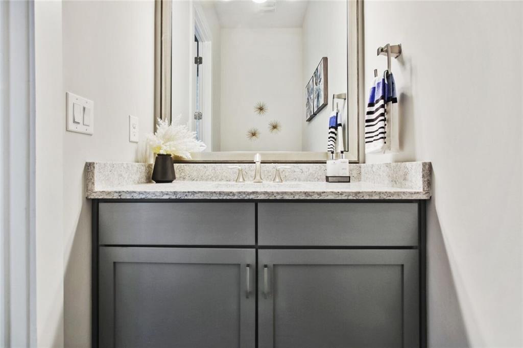 692 Drewry Street Northeast Atlanta, GA 30306 - Photo 20 of 25 a bathroom with a sink and a mirror