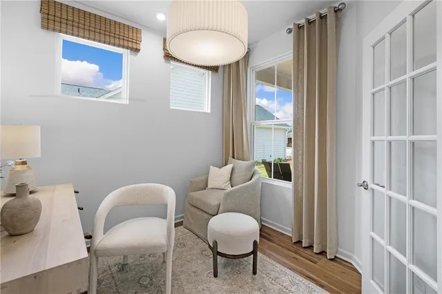 a living room with furniture and a large window