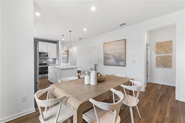 a dining room with furniture and window