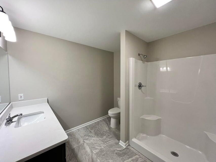 18388 Alexander Avenue Lowell, IN 46356 - Photo 16 of 17 a bathroom with a sink and a toilet