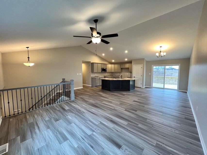 18388 Alexander Avenue Lowell, IN 46356 - Photo 4 of 17 wooden floor in an empty room with a window
