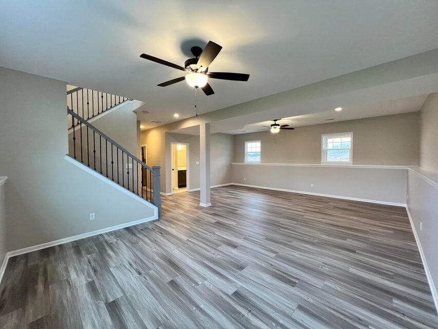 18388 Alexander Avenue Lowell, IN 46356 - Photo 6 of 17 a view of an empty room with wooden floor and a window