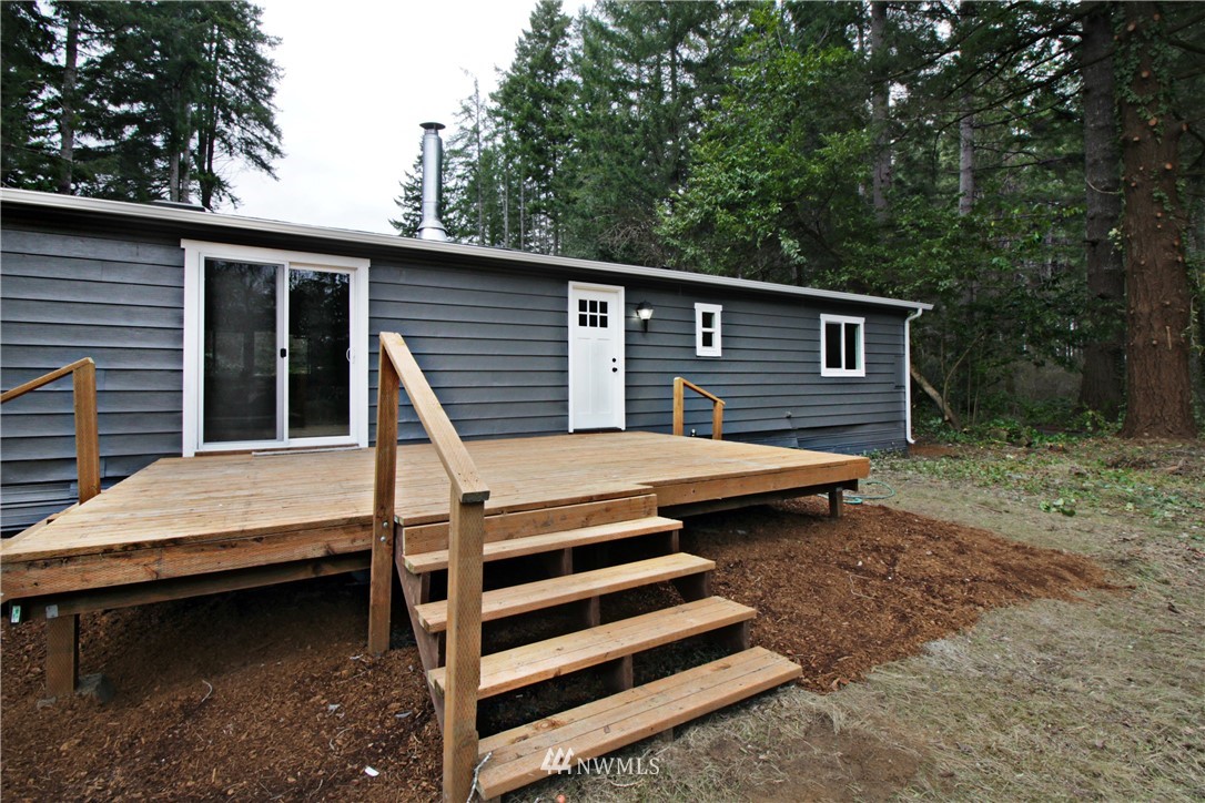 531 Northeast Beck Road Belfair, WA 98528 - Photo 14 of 14 a house view with a backyard space