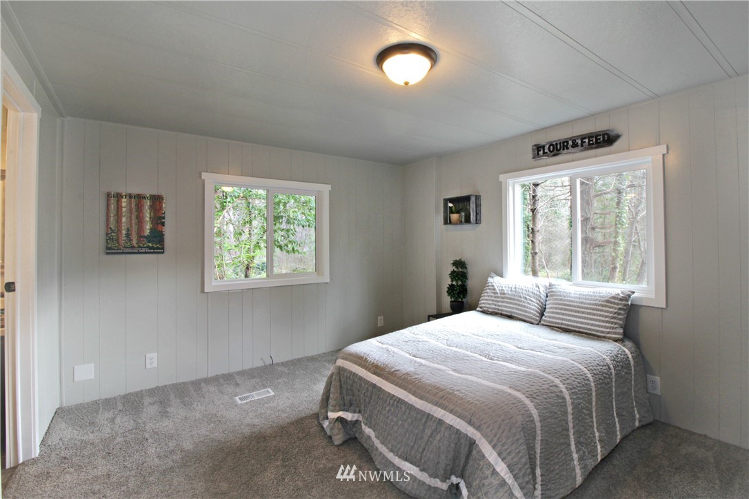 531 Northeast Beck Road Belfair, WA 98528 - Photo 6 of 14 a bedroom with a bed and a window