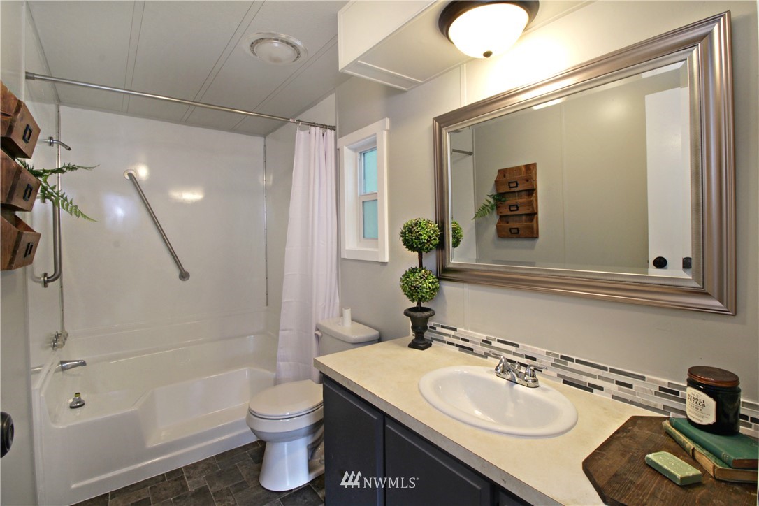 531 Northeast Beck Road Belfair, WA 98528 - Photo 7 of 14 a bathroom with a sink toilet and shower