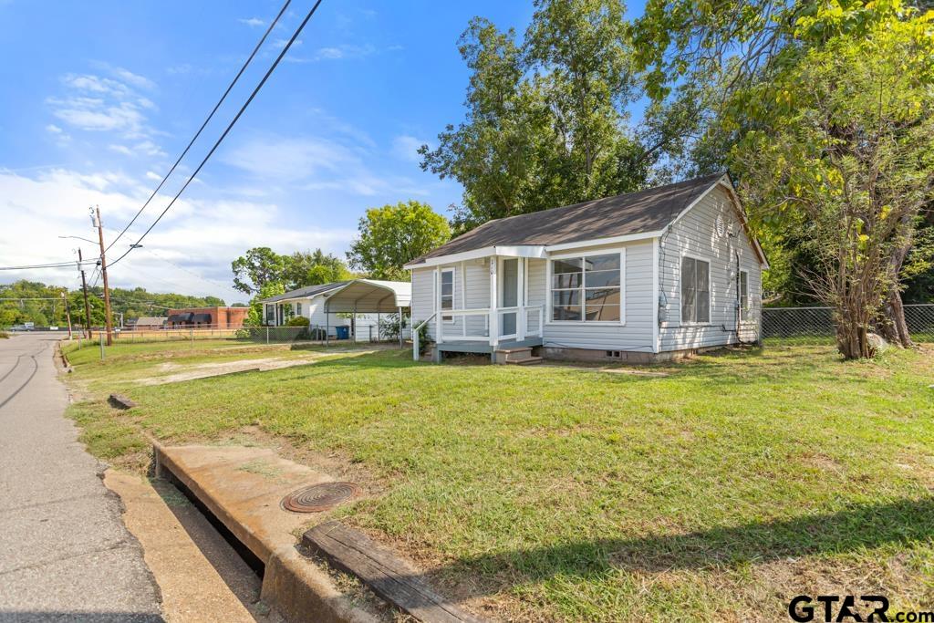 210 Cooper Street Lindale, TX 75771 - Photo 23 of 23 a view of a house with pool and a yard