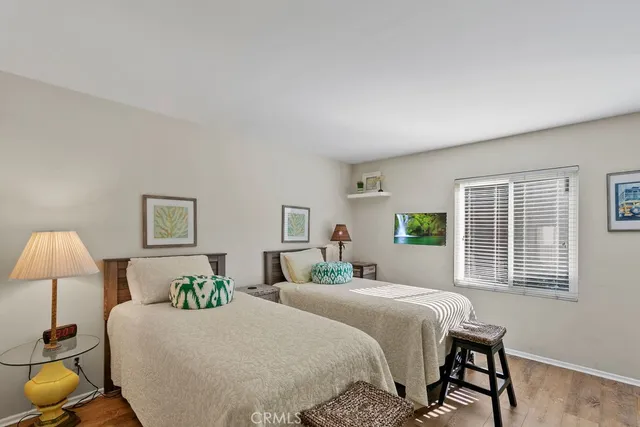 a bedroom with a bed and a lamp