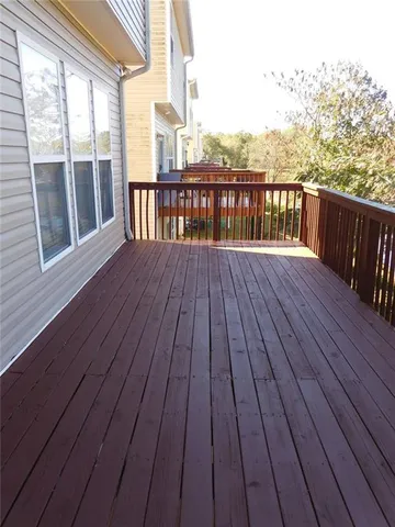 a view of wooden balcony with city view