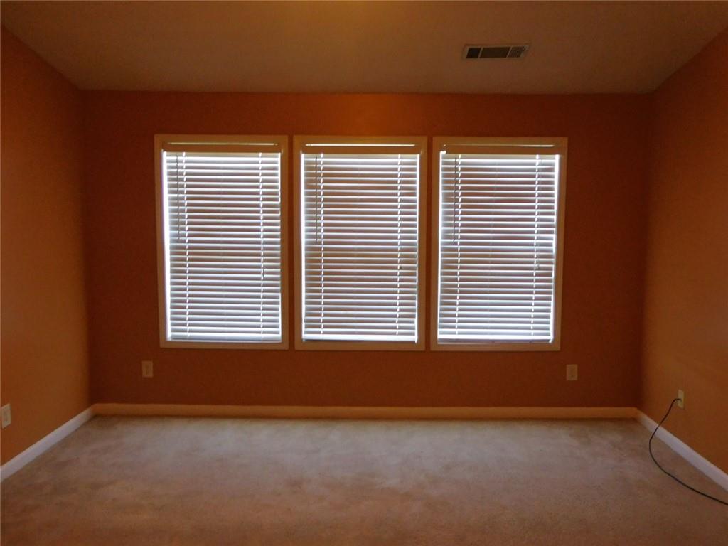 566 Pond Lillies Road Southeast Lawrenceville, GA 30045 - Photo 20 of 45 a view of an empty room with a window