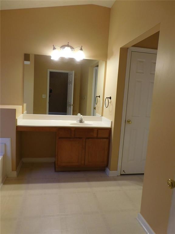 566 Pond Lillies Road Southeast Lawrenceville, GA 30045 - Photo 25 of 45 a bathroom with a double vanity sink mirror and