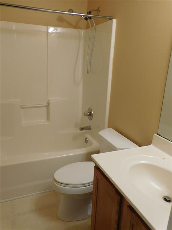 566 Pond Lillies Road Southeast Lawrenceville, GA 30045 - Photo 27 of 45 a bathroom with a sink a toilet and shower