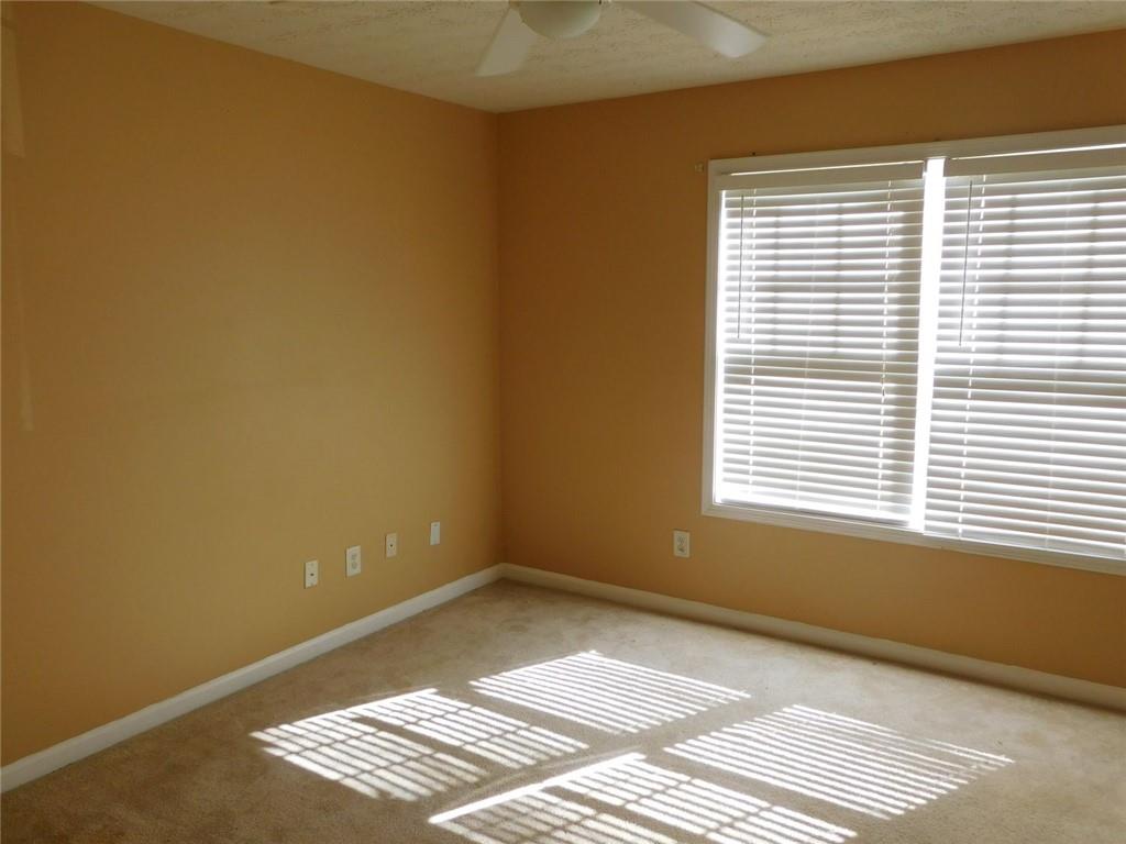 566 Pond Lillies Road Southeast Lawrenceville, GA 30045 - Photo 28 of 45 a view of an empty room with a window
