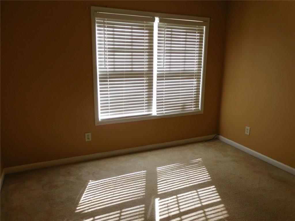 566 Pond Lillies Road Southeast Lawrenceville, GA 30045 - Photo 29 of 45 a view of an empty room with a window