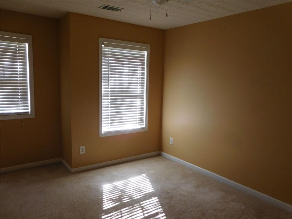 566 Pond Lillies Road Southeast Lawrenceville, GA 30045 - Photo 30 of 45 a view of an empty room with a window