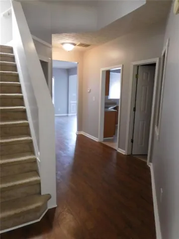 a view of an entryway with wooden floor