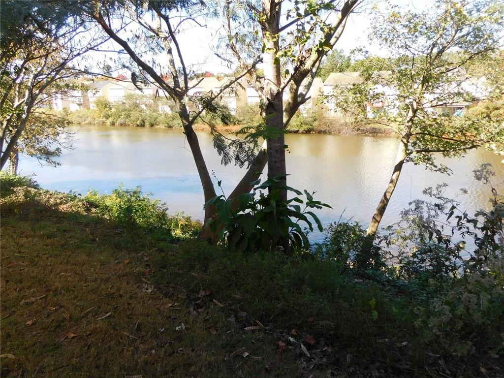 566 Pond Lillies Road Southeast Lawrenceville, GA 30045 - Photo 43 of 45 a view of lake with a yard