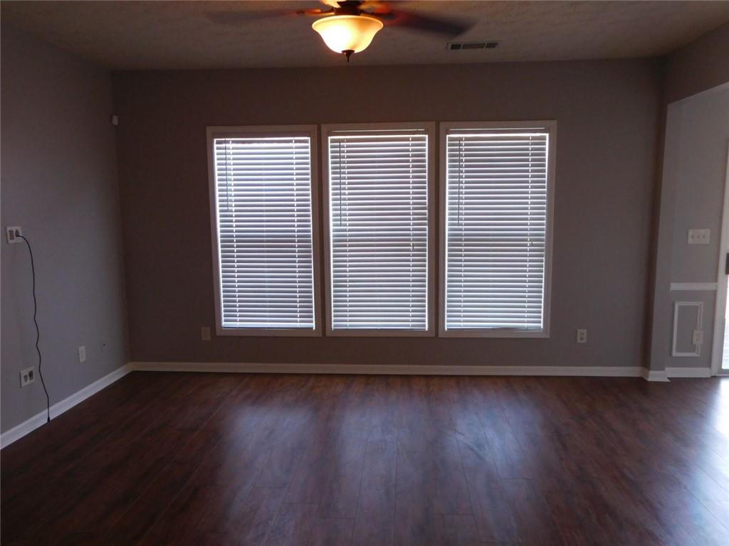 566 Pond Lillies Road Southeast Lawrenceville, GA 30045 - Photo 7 of 45 a view of wooden floor and windows in a room