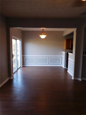 a view of room and hardwood floor