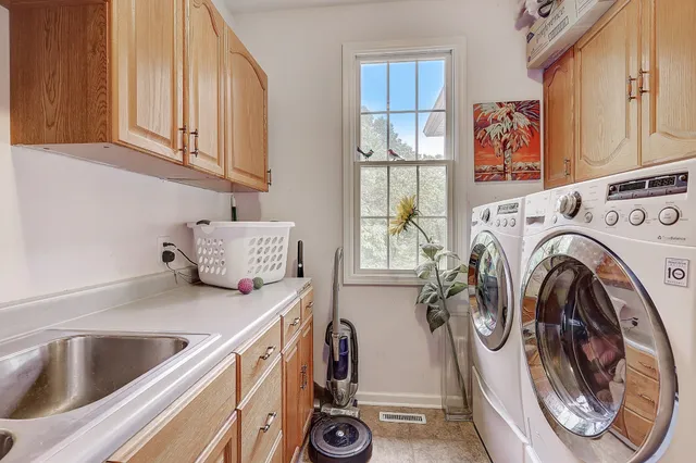 a work room with furniture and a flat screen tv