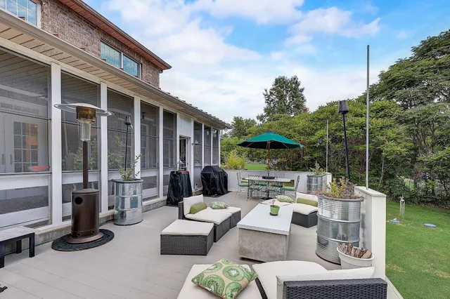 a front view of house with yard and outdoor seating