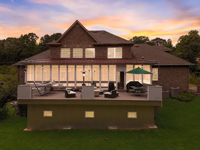 a view of outdoor space with deck and yard