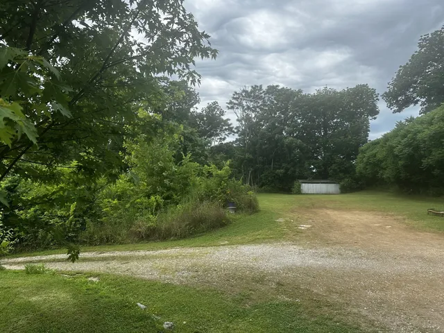 an aerial view of a house with a swimming pool