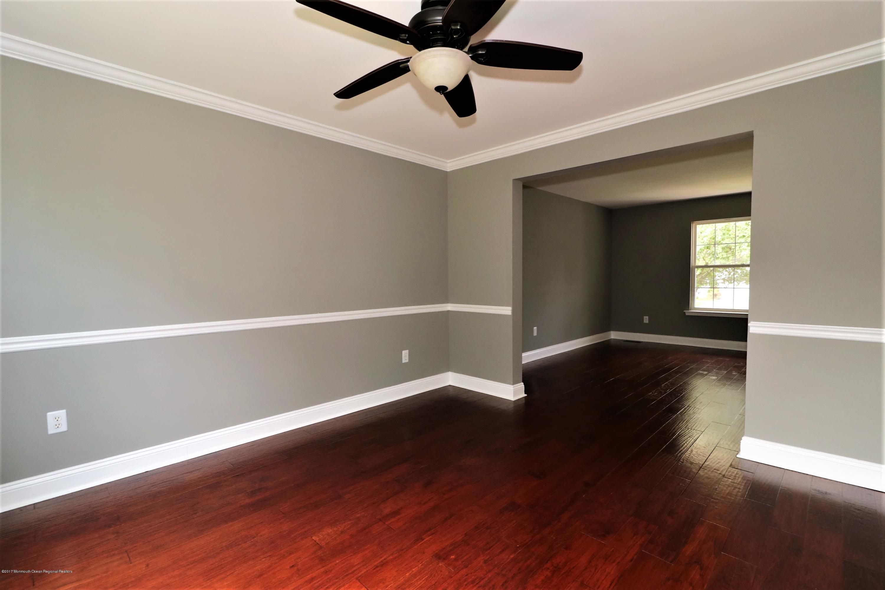 108 Sextant Road Manahawkin, NJ 08050 - Photo 18 of 49 wooden floor in an empty room with a window