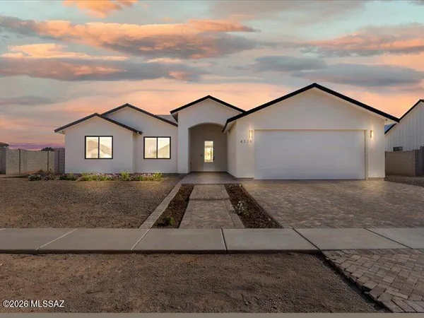 a front view of a house with yard