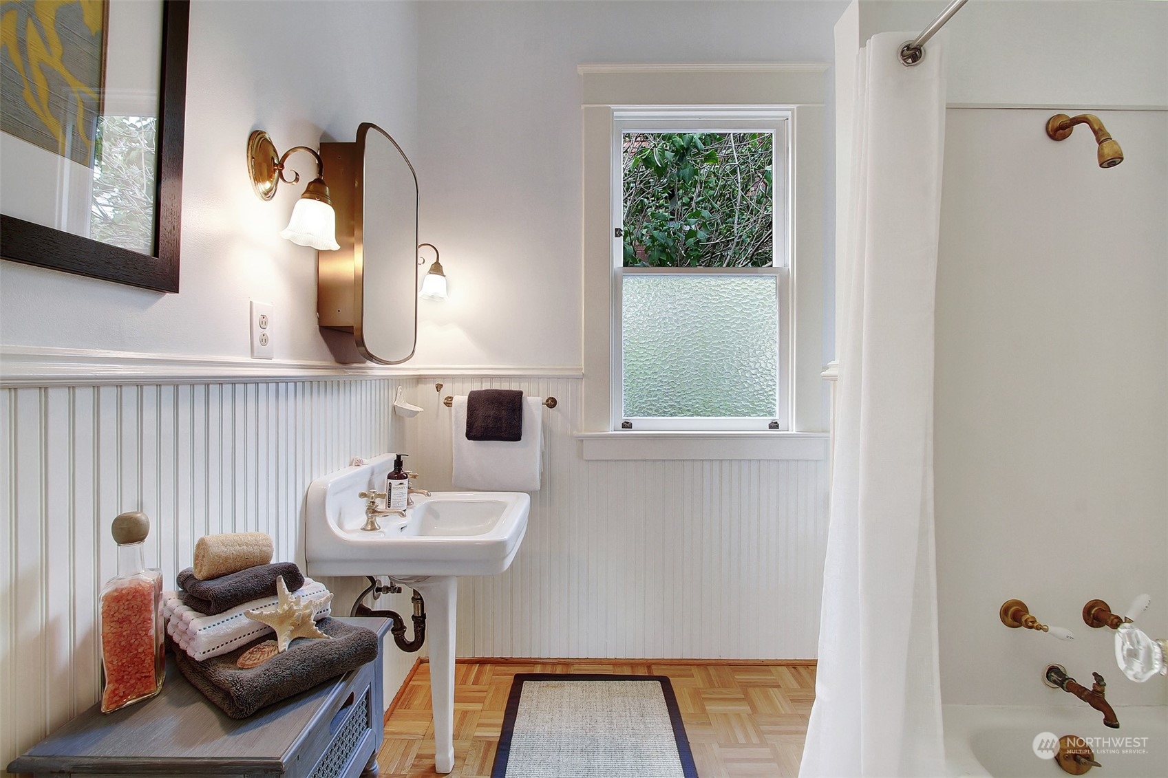 4019 Sunnyside Avenue North Seattle, WA 98103 - Photo 8 of 22 a bathroom with a sink and a mirror