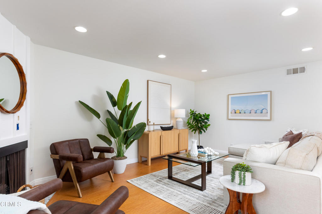 1485 Locust Street, Unit 1 Pasadena, CA 91106 - Photo 1 of 1 a living room with furniture a potted plant and a lamp