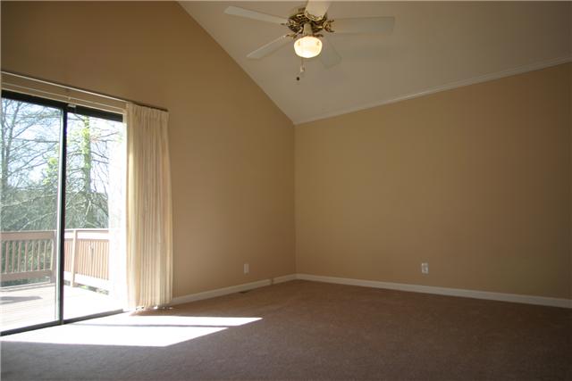 7309 Cavalier Road Nashville, TN 37221 - Photo 13 of 20 Another angle of Master Bedroom w/ Vaulted Ceiling and Slider to the Deck.