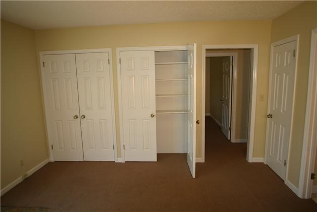 7309 Cavalier Road Nashville, TN 37221 - Photo 17 of 20 Lower Level Living Room w/ closeted Entertainment Shelving.