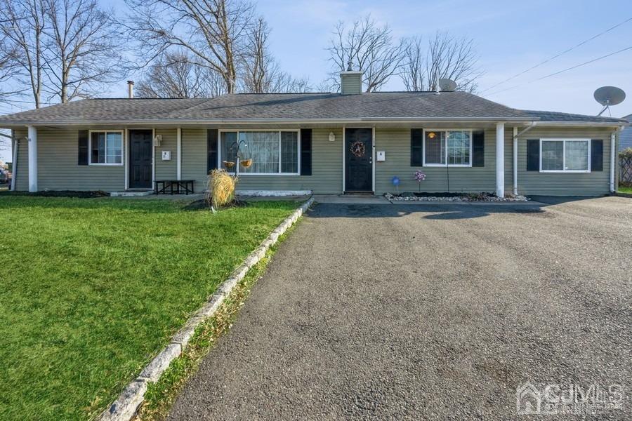 121 Winthrop Road Edison, NJ 08817 - Photo 1 of 16 a front view of a house with a garden