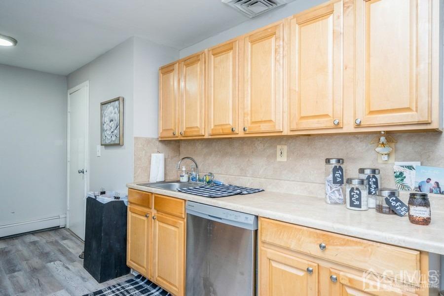 121 Winthrop Road Edison, NJ 08817 - Photo 11 of 16 a kitchen with stainless steel appliances granite countertop a sink stove and cabinets