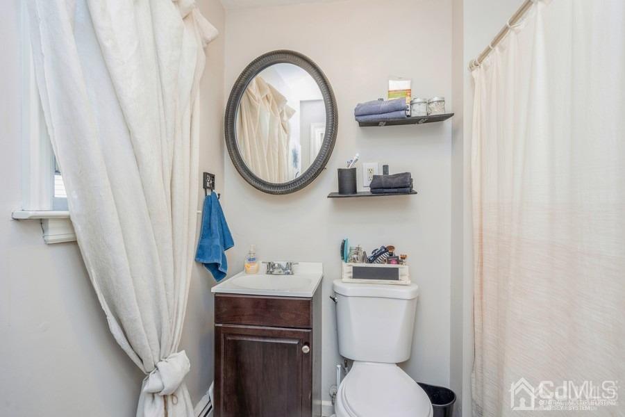 121 Winthrop Road Edison, NJ 08817 - Photo 15 of 16 a bathroom with a toilet and a sink