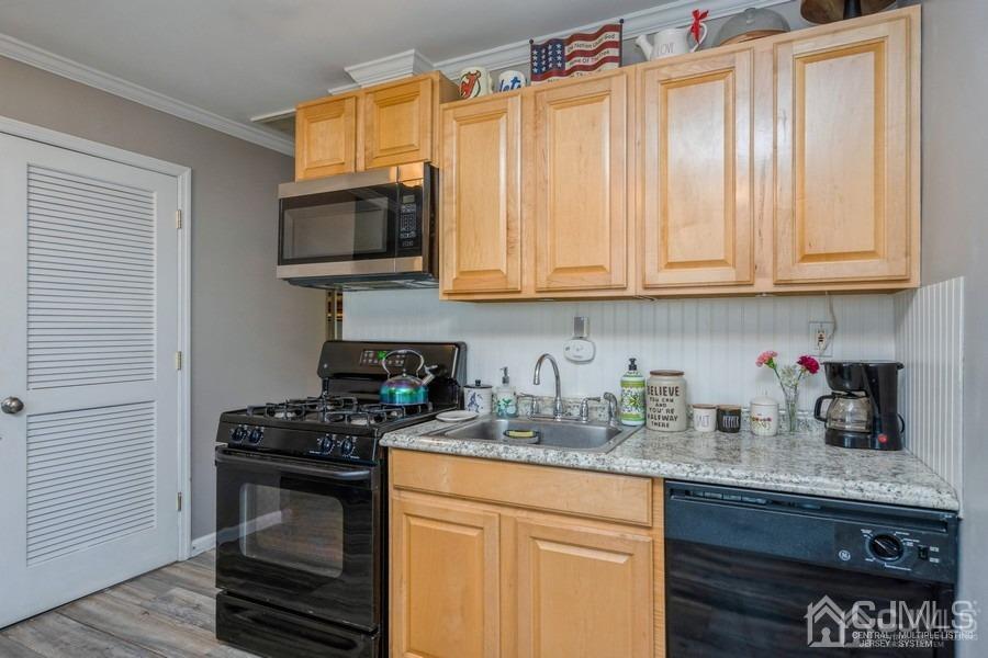121 Winthrop Road Edison, NJ 08817 - Photo 3 of 16 a kitchen with stainless steel appliances granite countertop a stove a sink and a microwave