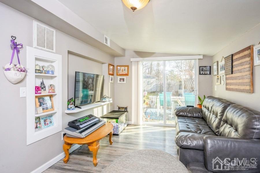 121 Winthrop Road Edison, NJ 08817 - Photo 4 of 16 a living room with furniture and a window