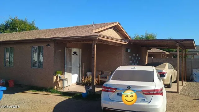 a front view of a house with fountain
