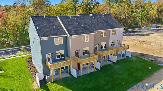 aerial view of a house with a yard