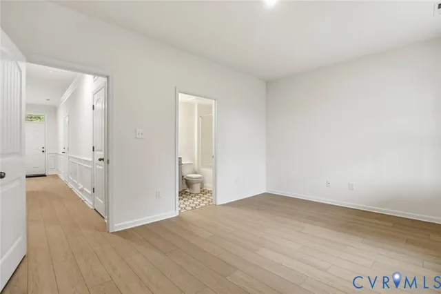 a bathroom with a sink toilet vanity and tub
