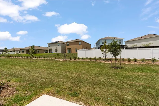 a view of a yard in front of a house