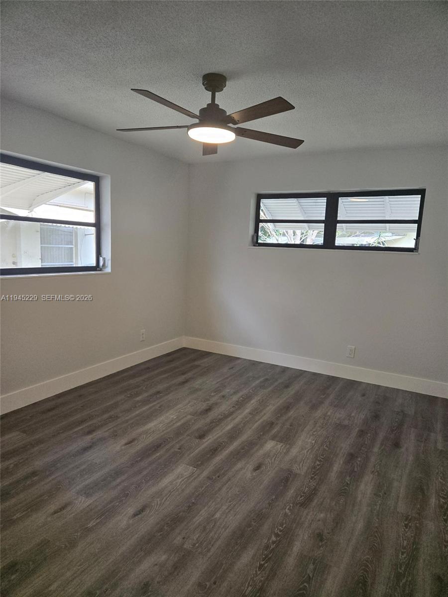 6855 Northwest 9th Street Margate, FL 33063 - Photo 11 of 21 a view of a room with wooden floor