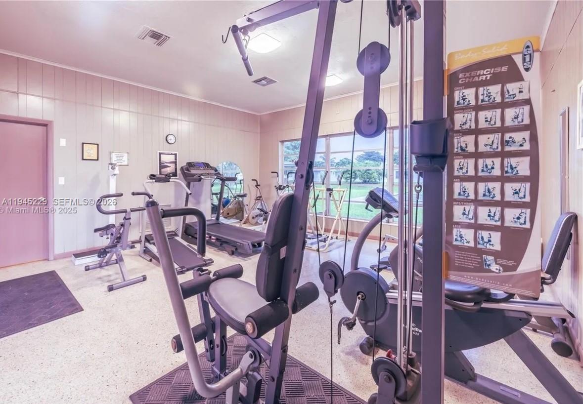 6855 Northwest 9th Street Margate, FL 33063 - Photo 20 of 21 a view of a room with gym equipment