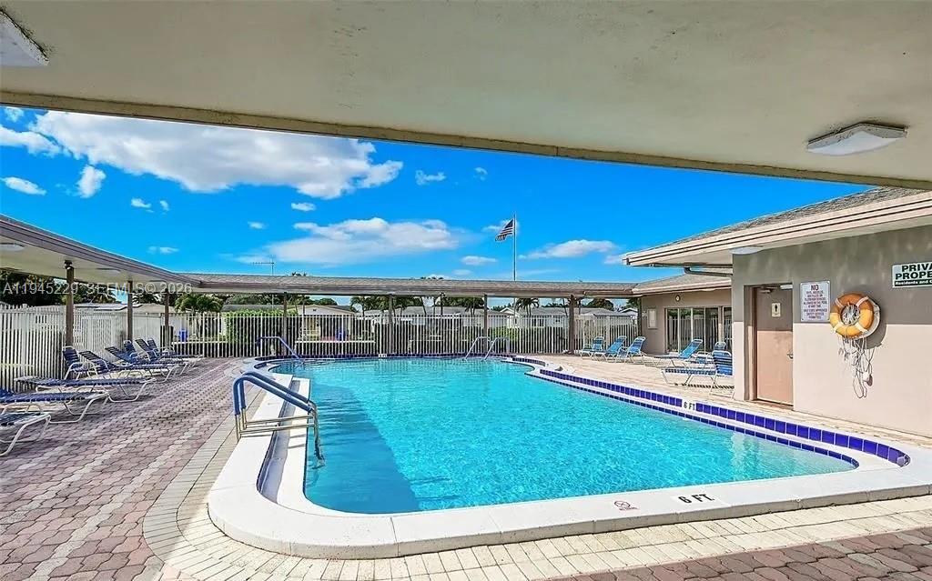 6855 Northwest 9th Street Margate, FL 33063 - Photo 21 of 21 a room with wooden floor pool table and chairs