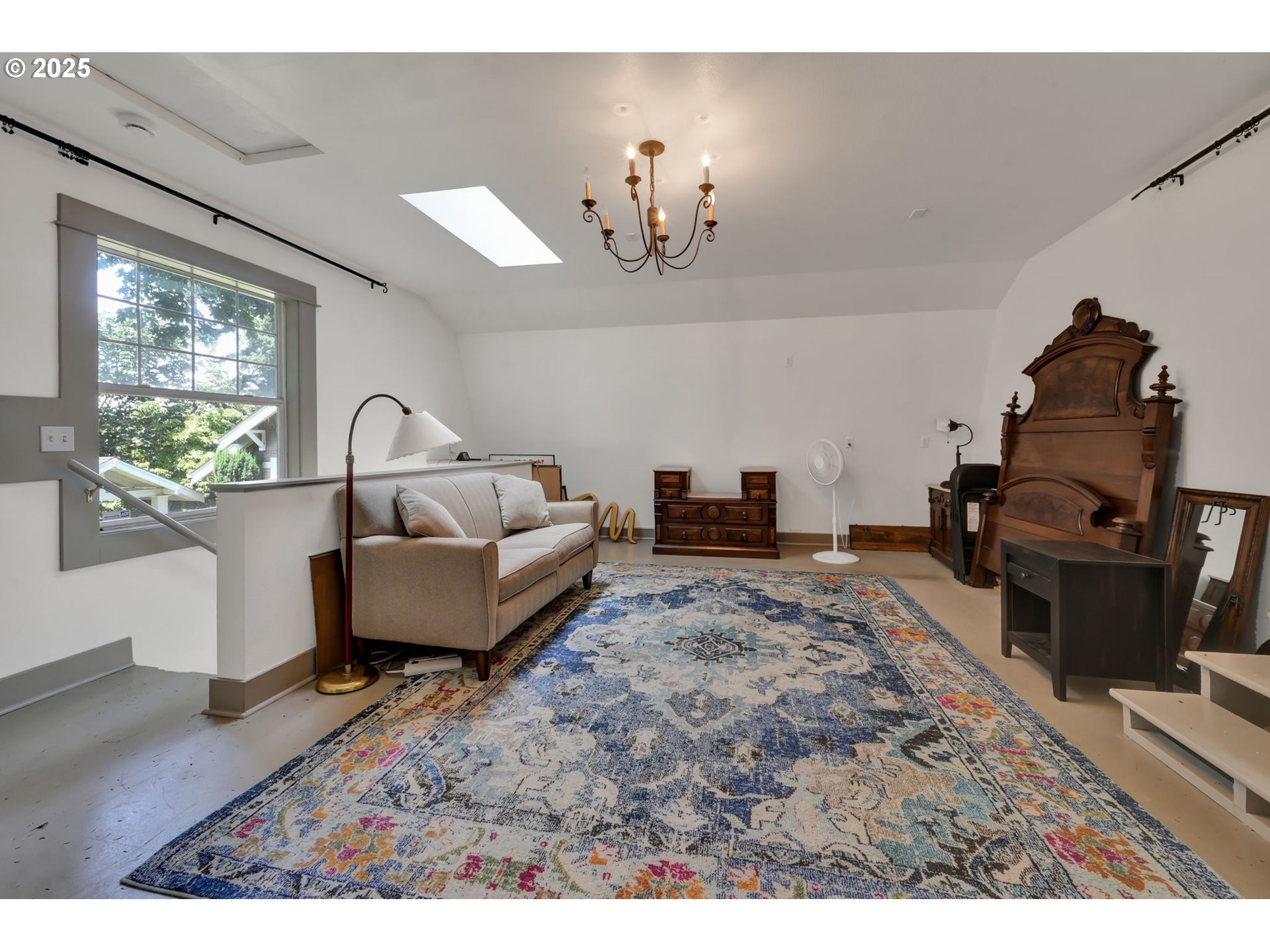 1306 Bogart Lane Eugene, OR 97401 - Photo 33 of 43 a living room with furniture a chandelier and a large window
